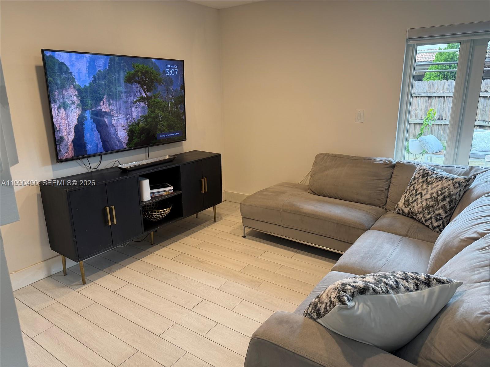 7431 Southwest 163rd Place Miami, FL 33193 - Photo 7 of 18 a living room with furniture and window