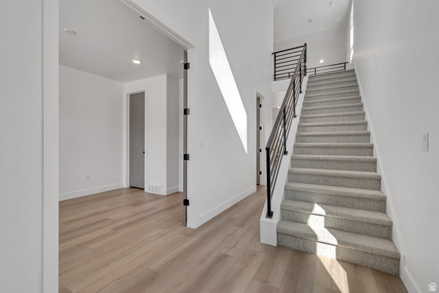 1302 1475 East, Unit 40 Payson, UT 84651 - Photo 4 of 34 Stairs featuring recessed lighting and wood finished floors