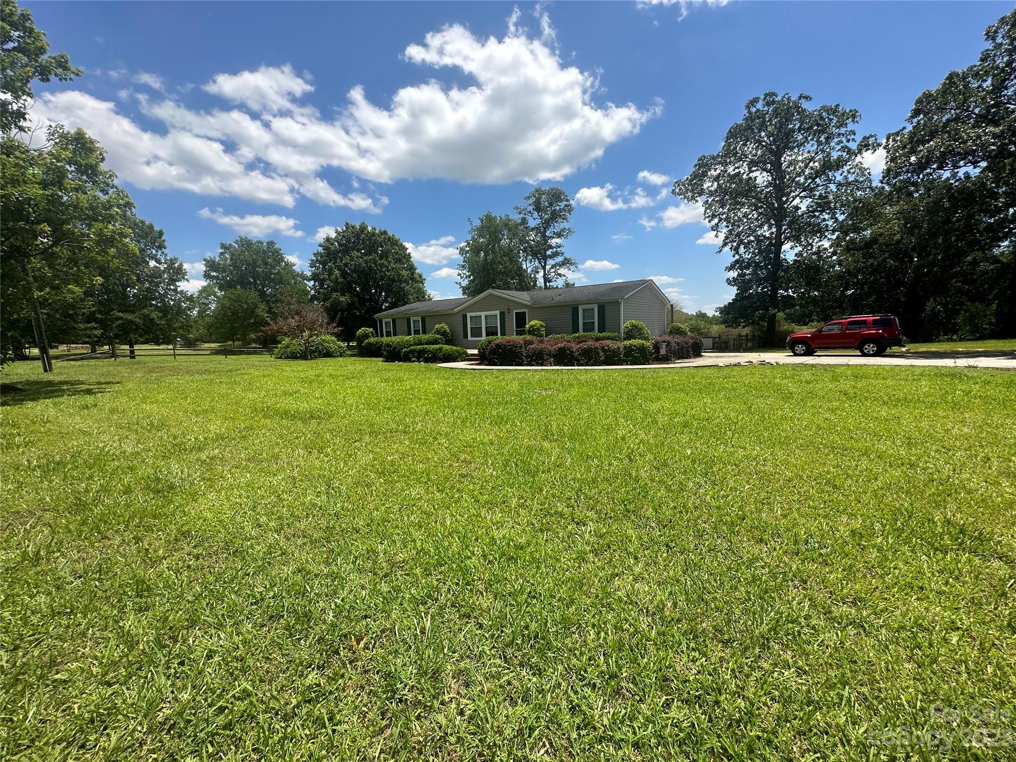 2780 Camp Creek Road Lancaster, SC 29720 - Photo 1 of 33 a view of a big yard with plants and large trees