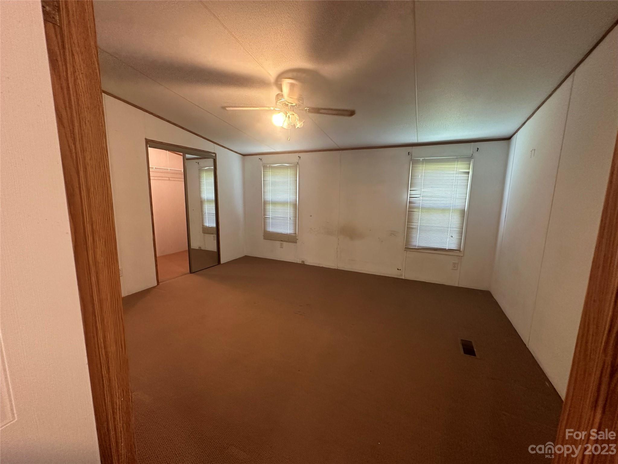 2780 Camp Creek Road Lancaster, SC 29720 - Photo 23 of 33 an empty room with windows and closet