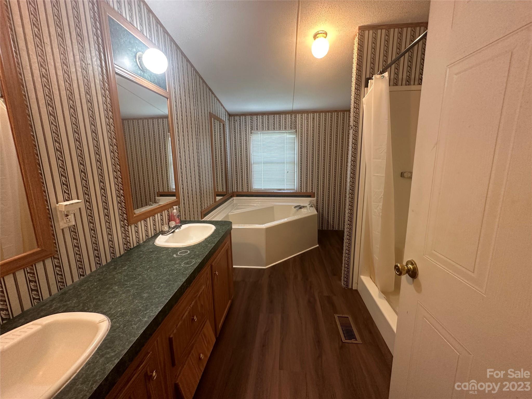 2780 Camp Creek Road Lancaster, SC 29720 - Photo 24 of 33 a bathroom with a granite countertop sink and a mirror