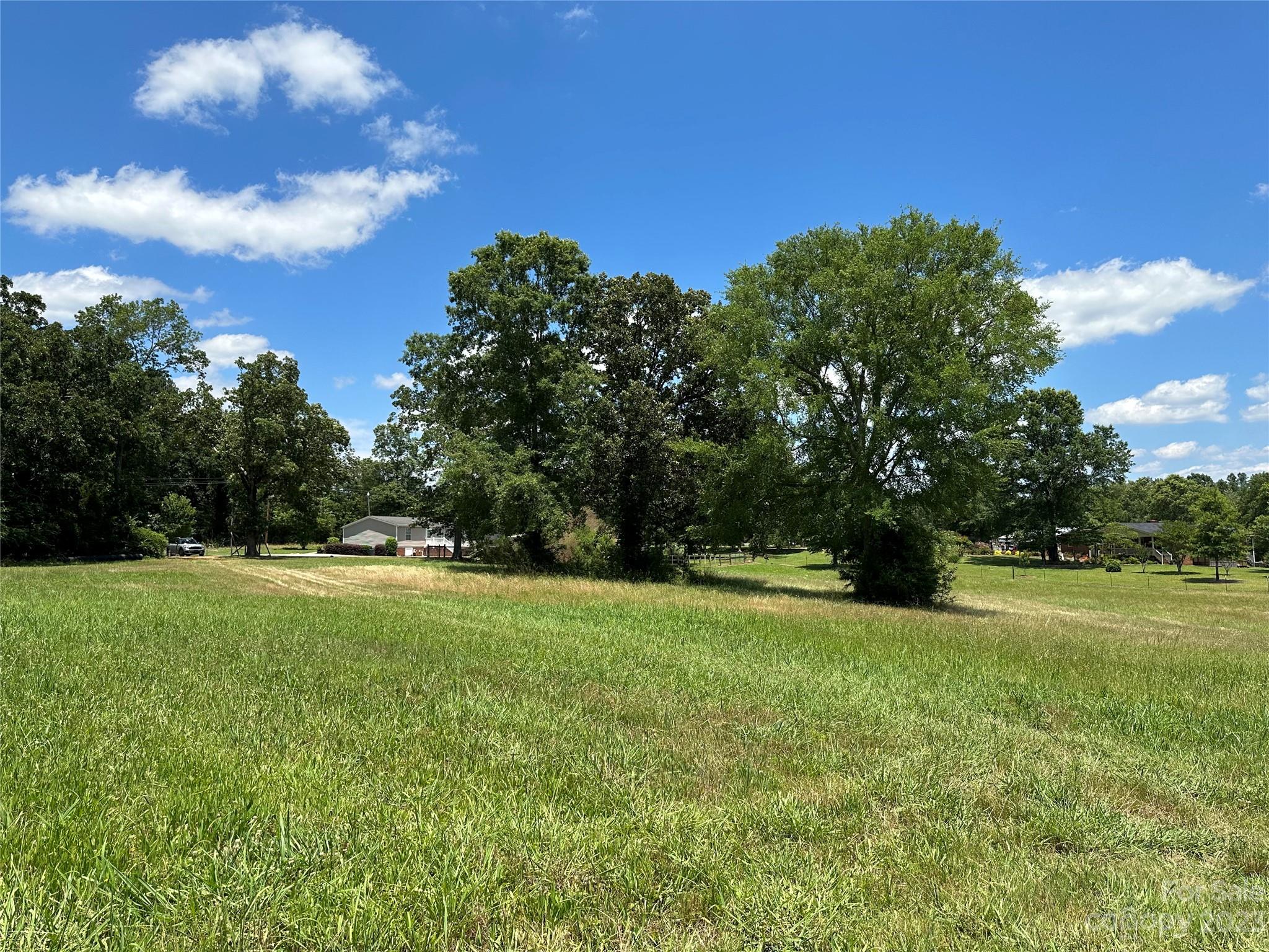 2780 Camp Creek Road Lancaster, SC 29720 - Photo 7 of 33 a view of field with trees in the background