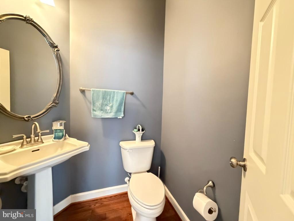 9804 Anvil Court Perry Hall, MD 21128 - Photo 10 of 21 a bathroom with a toilet a sink and mirror