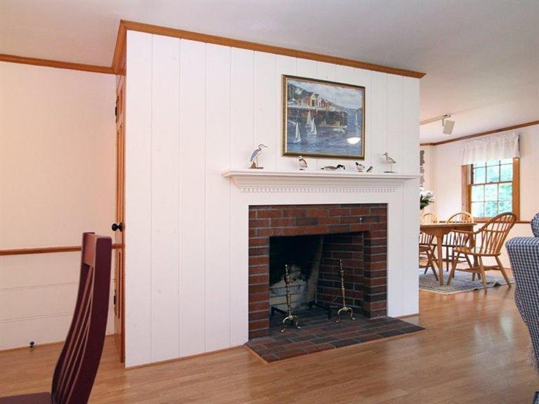 26 Grey Neck Road, Unit 2 West Harwich, MA 02671 - Photo 5 of 19 a living room with furniture and a fireplace