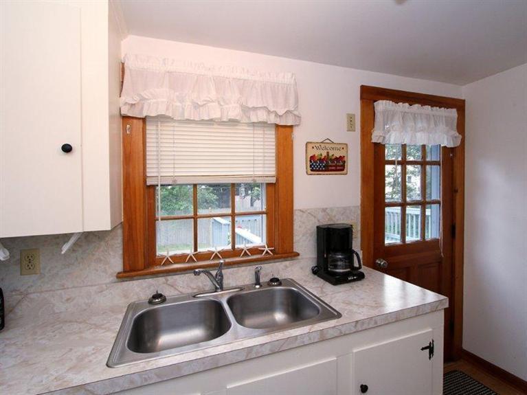 26 Grey Neck Road, Unit 2 West Harwich, MA 02671 - Photo 8 of 19 a kitchen with a sink and a window