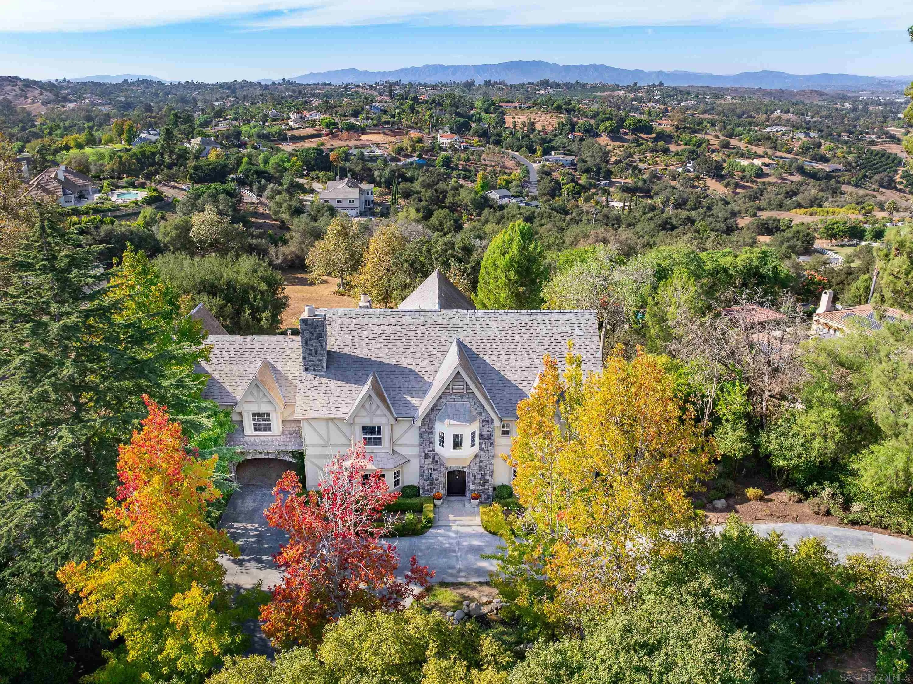 an aerial view of a house with a garden