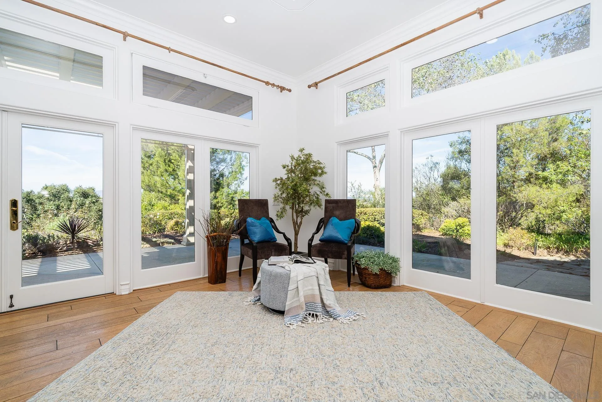 5 Rollingview Lane Fallbrook, CA 92028 - Photo 27 of 74 a living room with furniture and potted plants