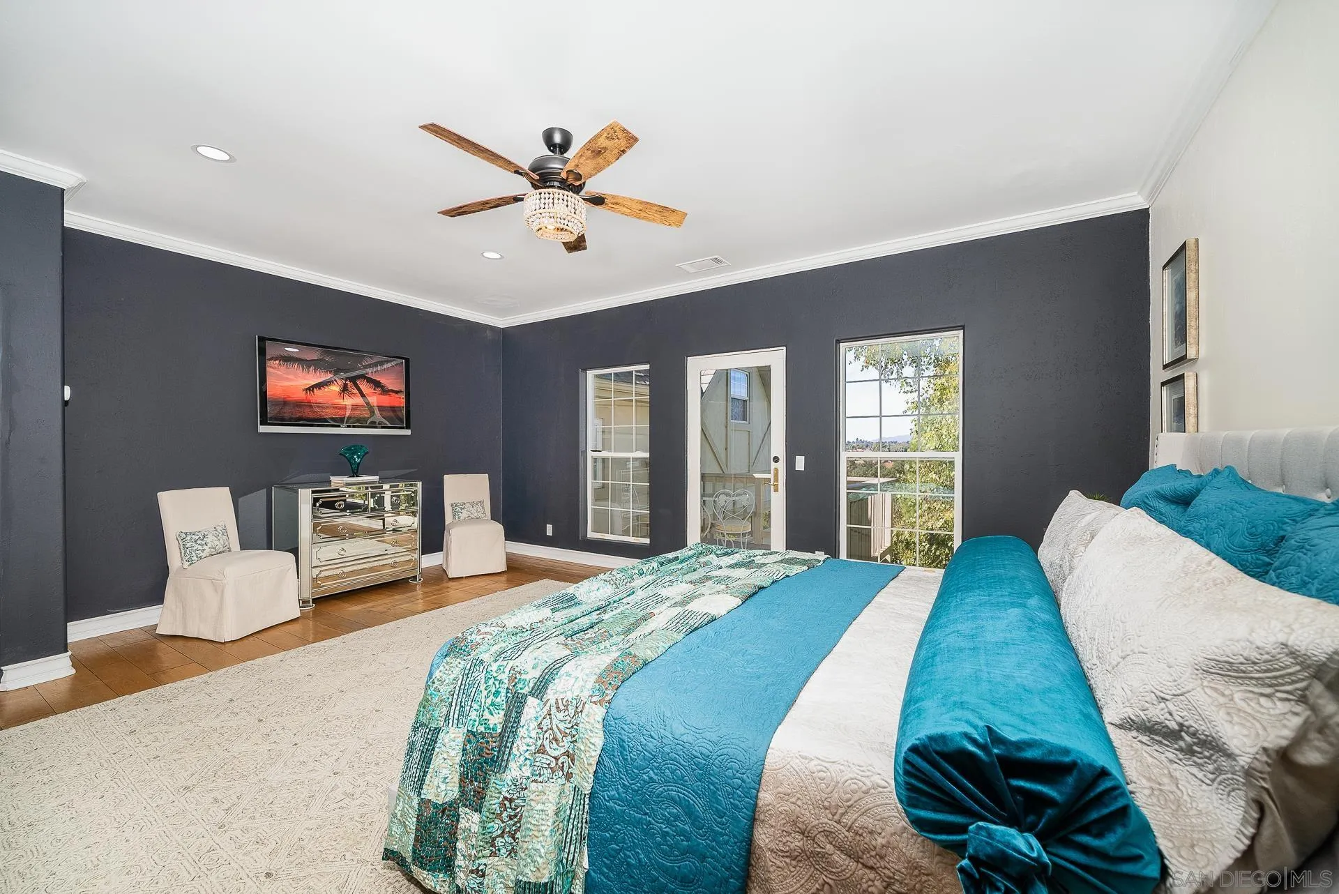 5 Rollingview Lane Fallbrook, CA 92028 - Photo 37 of 74 a bedroom with a large bed and a chandelier