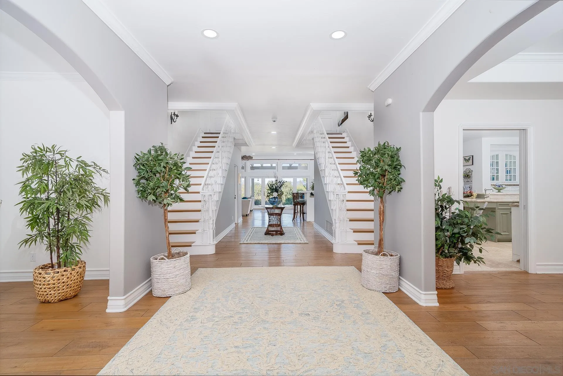 5 Rollingview Lane Fallbrook, CA 92028 - Photo 7 of 74 a hallway with a potted plant and a large window