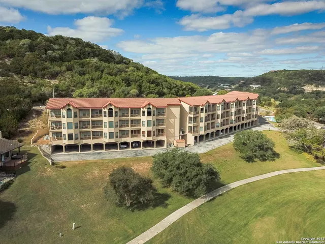 a view of a large building with a big yard