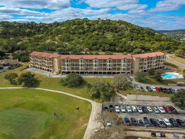 a view of a field with mountains in the background