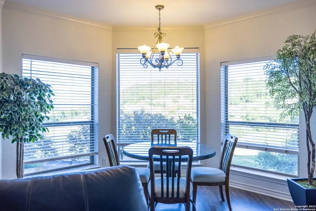 a view of a dining room with furniture window and outside view