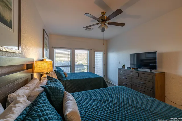 a bedroom with a bed and furniture