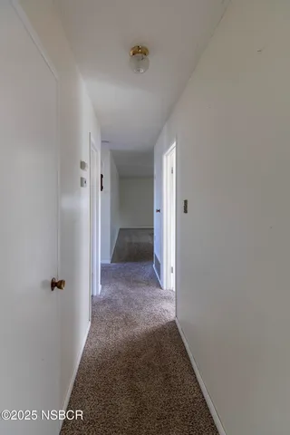 a view of an empty room with a garage