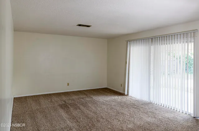 a view of an empty room and window