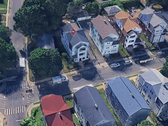 an aerial view of residential houses with outdoor space