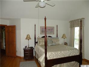220 Abner Road Stony Point, NC 28678 - Photo 11 of 16 a room with a bed and furniture