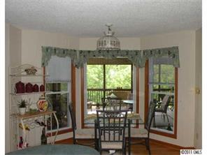 220 Abner Road Stony Point, NC 28678 - Photo 13 of 16 a very nice looking room with a large window and dining table