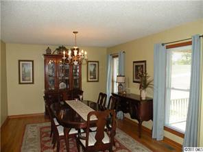 220 Abner Road Stony Point, NC 28678 - Photo 8 of 16 a view of a dining room with furniture and chandelier