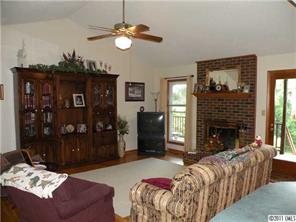220 Abner Road Stony Point, NC 28678 - Photo 9 of 16 a living room with furniture and a fireplace