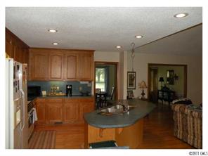 220 Abner Road Stony Point, NC 28678 - Photo 10 of 16 a kitchen with sink refrigerator and cabinets