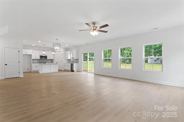 a view of a kitchen with a sink and a window