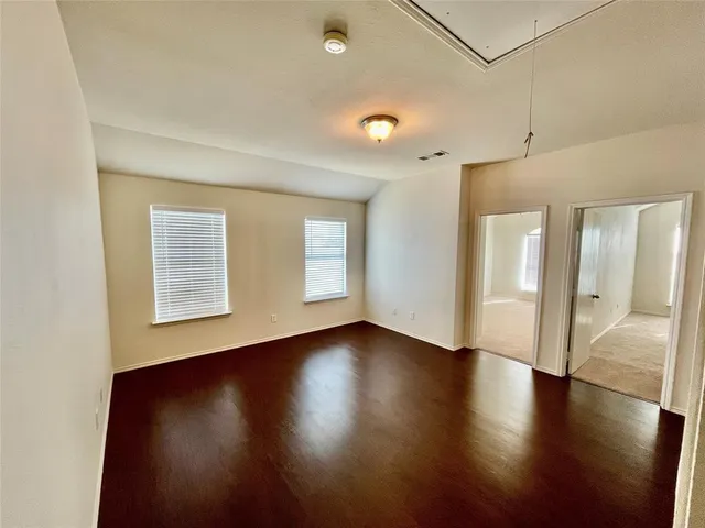 a view of empty room with windows