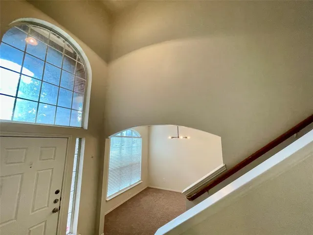 a view of empty room with windows