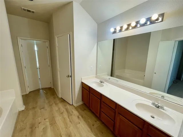 a bathroom with a tub and a shower
