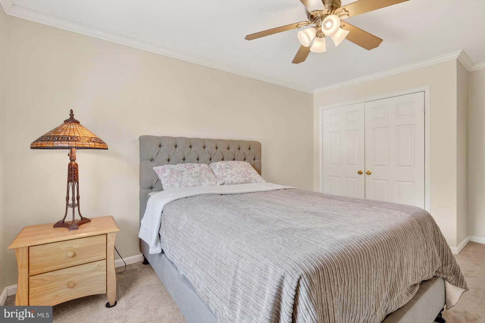 2108 Merrifields Drive Silver Spring, MD 20906 - Photo 40 of 69 a bedroom with a bed and a chandelier