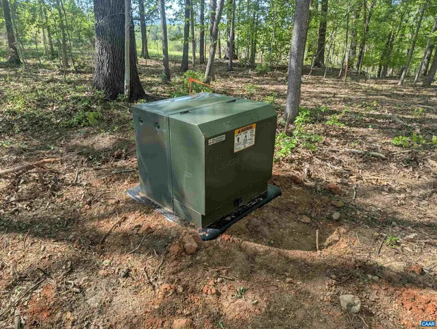 a view of a lush green space with a lake view