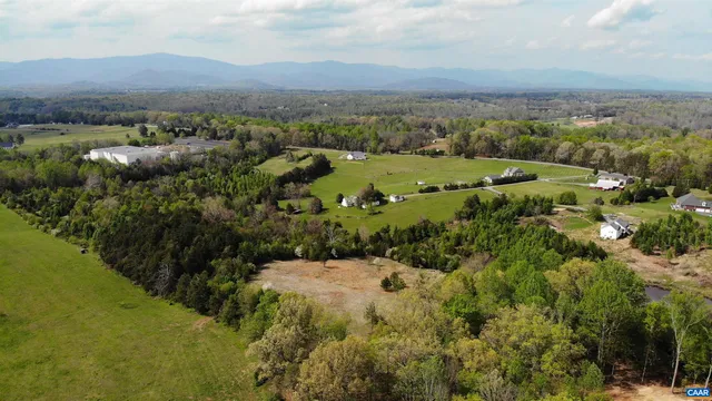 an aerial view of a house with mountain view