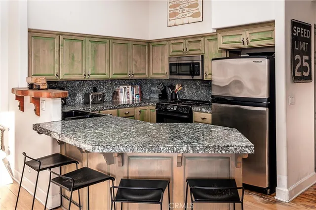 a kitchen with a table and chairs in it