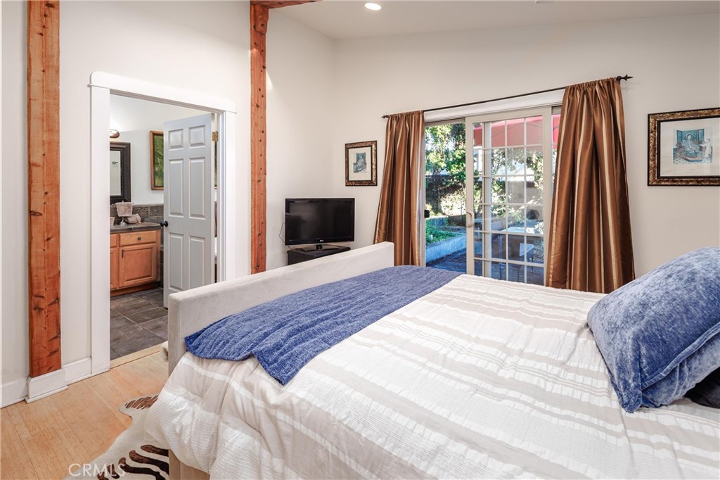 50 South 3rd Street Cayucos, CA 93430 - Photo 22 of 37 Master Bedroom with vaulted and beamed ceilings and backyard access