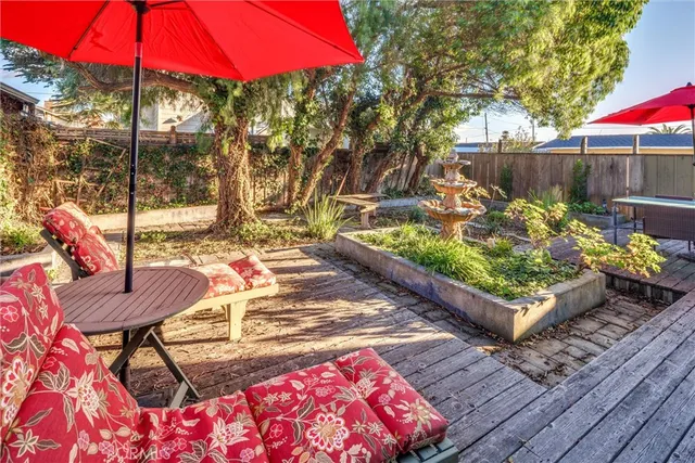 a backyard of a house with yard barbeque oven and outdoor seating