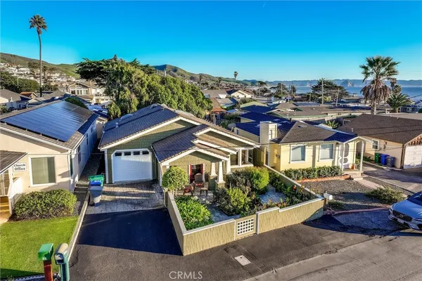 an aerial view of a house with a ocean view