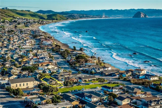an aerial view of a house with a ocean view