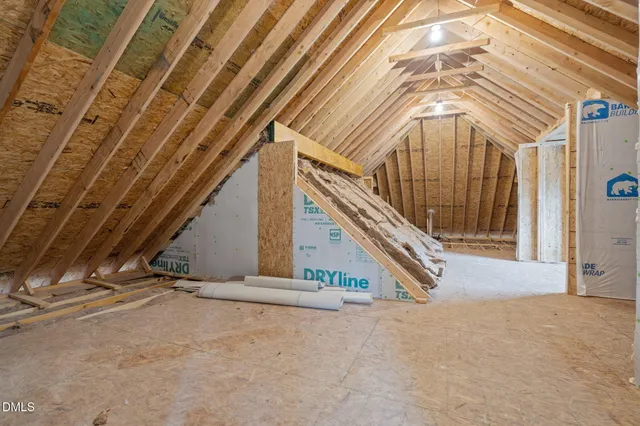 a view of a house with wooden deck