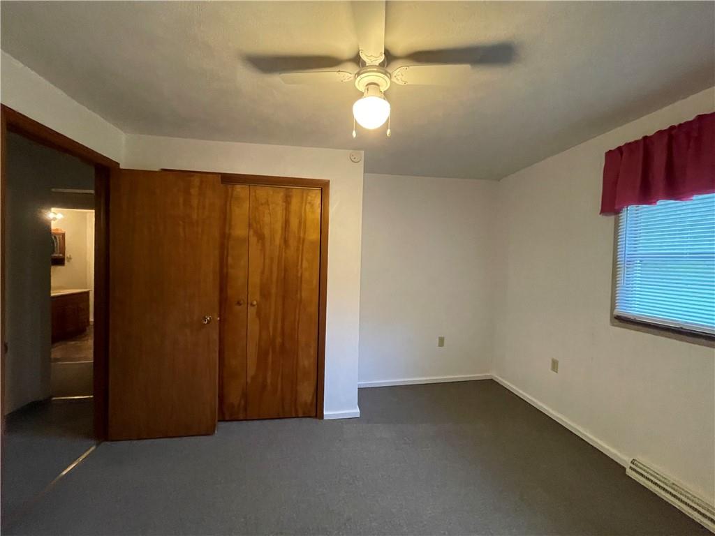 474 Iron Rock Road Waynesburg, PA 15370 - Photo 11 of 15 an empty room with windows and fan
