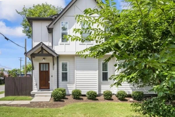 a front view of a house with garden
