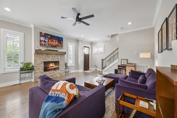 a living room with furniture and a fireplace
