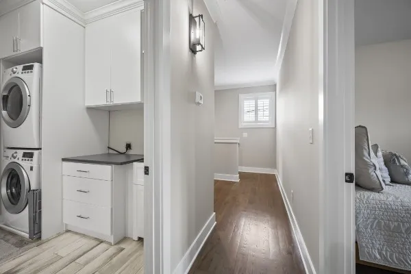a view of a hallway with washer and dryer