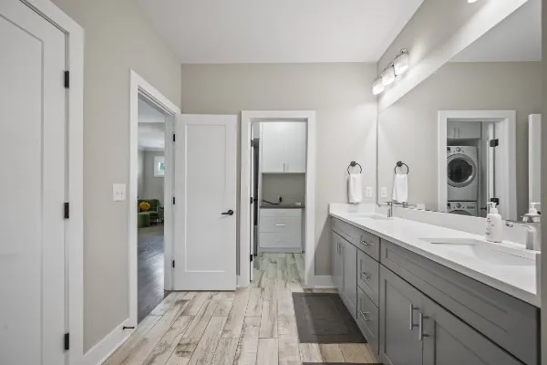 a spacious bathroom with a double vanity sink and a mirror