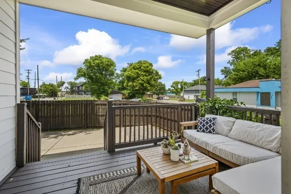a view of a balcony with furniture