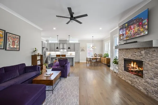 a living room with furniture and a fireplace