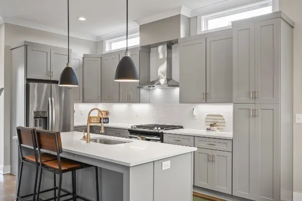 a kitchen with a sink cabinets and window