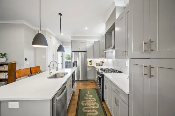 a kitchen that has a lot of cabinets in it