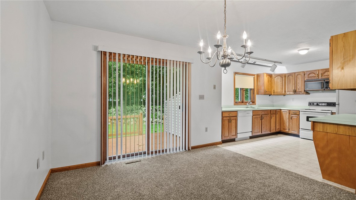 447 Stafford Road, Unit C1 Tiverton, RI 02878 - Photo 12 of 33 Kitchen & Slider to Rear Deck