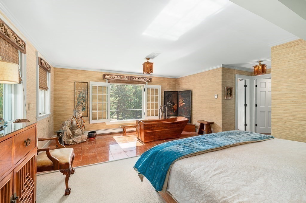 25 Leverett Street Gloucester, MA 01930 - Photo 17 of 41 a bedroom with a large bed and large windows