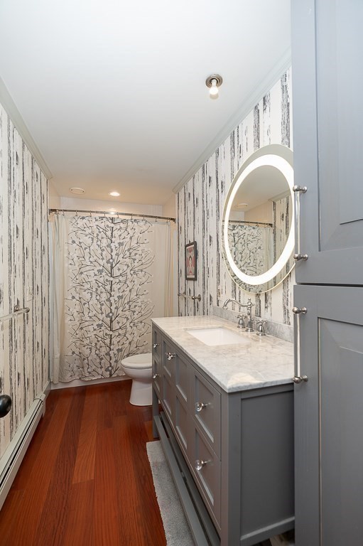 25 Leverett Street Gloucester, MA 01930 - Photo 21 of 41 a bathroom with a sink mirror vanity and a toilet